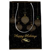 Gold lantern en stofzucht over zwarte achtergrond medium cadeauzakje (Voorkant)