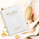 Gold Script Future Mme Wedding planner<br><div class="desc">Le design romantique présente une fleur florale douce en blanc, "Future Mrs", et les mots "Plans Mariages" dans un script de typographie or contre un arrière - plan texturé blanc. Customisez facilement vos noms et la date de votre choix. L'idée cadeau parfait pour la future mariée pour organiser tous ses...</div>