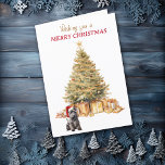 Gold Tree Scottish Terrier Dog Carte de Noël<br><div class="desc">Sur le devant de cette carte de Noël, un adorable chien écossais Terrier porte un chapeau de Père Noël rouge et blanc et se trouve devant un arbre de Noël. L'arbre est décoré d'or, et les paquets cadeaux correspondants sont sous lui. Le texte en or et en rouge dit "Je...</div>