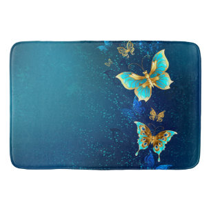 Golden Butterflies op een blauwe achtergrond Badmat