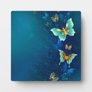 Golden Butterflies op een blauwe achtergrond Fotoplaat