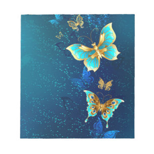 Golden Butterflies op een blauwe achtergrond Notitieblok