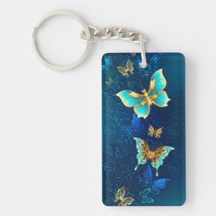 Golden Butterflies op een blauwe achtergrond Sleutelhanger