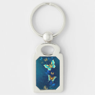 Golden Butterflies op een blauwe achtergrond Sleutelhanger