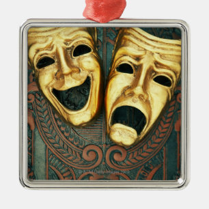 Golden comedy en tragedie maskers op gevlekt metalen ornament