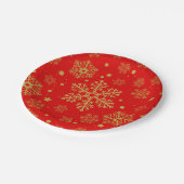 Golden sneeuwvlokken op rood papieren bordje (Gekanteld)