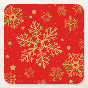 Golden sneeuwvlokken op rood vierkante kartonnen onderzetter