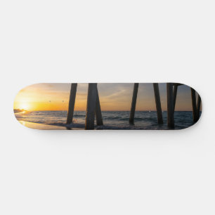 Golden Sunrise onder Pensacola Pier Skateboard