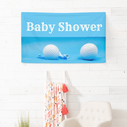 Golfbaby shower met golfbal en t-shirt op blauw spandoek (Insitu)