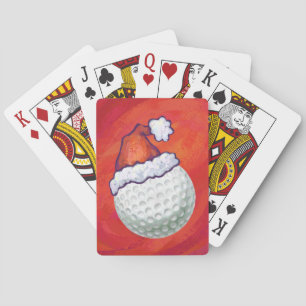 Golfbal in Santa Hat op rood Pokerkaarten
