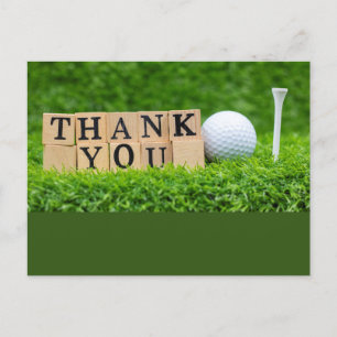 Golfbal met het woord dank je wel op groen gras briefkaart