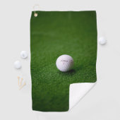 Golfbal op een groene ondergrond Golf Handdoeken (Insitu)