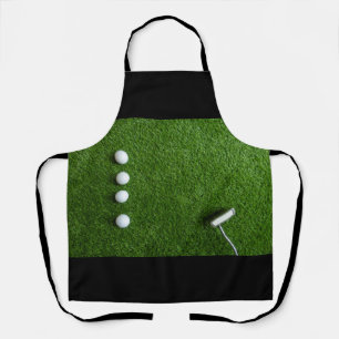Golfbal op groen gras schort
