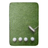 Golfballen zijn op groen grasbadmat badmat (Voorkant Verticaal)