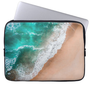 Golven op zandstrand laptop sleeve