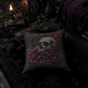 Gotische droevige schedel met bloemen kussen