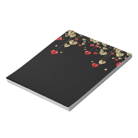 Goud en rood hart op zwarte achtergrond notitieblok (Gedraaid)