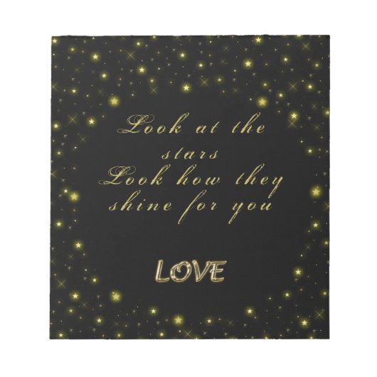 Goud en sparkles sterren op zwart notitieblok (Voorkant)