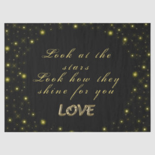 Goud en sparkles sterren op zwart tissuepapier