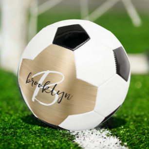 Goud geborsteld metaal zwart wit schrift monogram voetbal