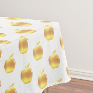 Gouden appels op wit tafelkleed