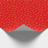 Gouden confetti op rood cadeaupapier (Hoek)