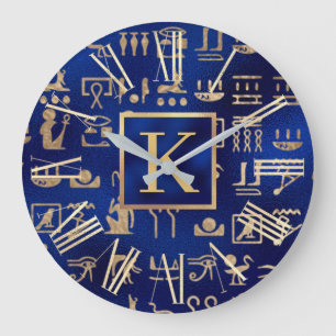 Gouden Egyptische hiërogliefen op blauwe initiaal Grote Klok