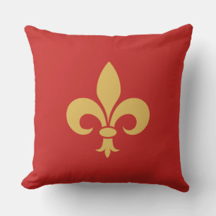 Gouden Fleur de Lis op karmozijnrood Kussen