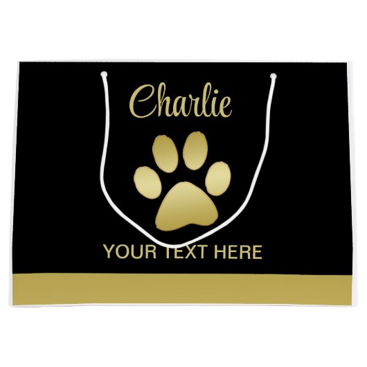 Gouden glanzende hondenpoot op zwarte achtergrond groot cadeauzakje