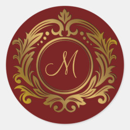 Gouden kam met monogram initiaal op rood ronde sticker