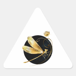 Gouden libel in zwarte cirkel driehoek sticker