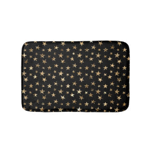 Gouden metallic sterren op zwart badmat