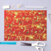 gouden muzieknoten in het rood tissuepapier (Craft)