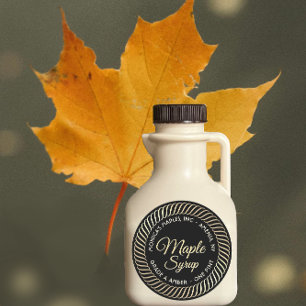 Gouden spiraal rand esdoorn siroop label op zwart