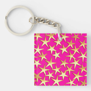 Gouden sterren op fuchsia roze sleutelhanger