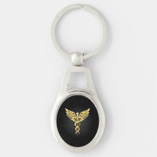 Gouden veelhoekig symbool Caduceus Sleutelhanger