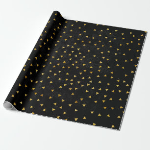 Gouden vlekjes op grunge zwart cadeaupapier