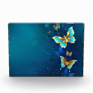 Gouden Vlinders op een Blauwe Achtergrond Fotoblokken