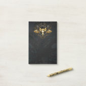 Gouden vogel schedel op zwarte achtergrond post-it® notes (Op bureau)