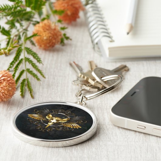 Gouden vogel schedel op zwarte achtergrond sleutelhanger (Zijkant)