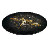 Gouden vogel schedel op zwarte achtergrond snijplank (Hoek)