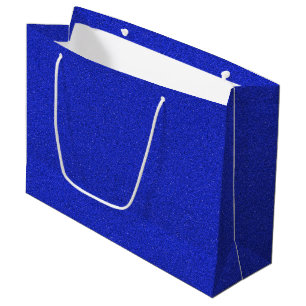 Grand Sac Cadeau Un sac-cadeau pailleté bleu avec des poignées blan