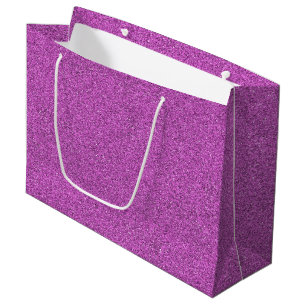 Grand Sac Cadeau Un sac-cadeau pailleté violet avec des poignées bl