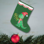 Grande Chaussette De Noël Cute Green Dinosaur Personnalisé<br><div class="desc">Voici une jolie image de dinosaure sur ce magasin de vacances personnalisé qui plaira à n'importe quel petit garçon ! Le dinosaure est une image aquarelle dans les tons verts, et il porte un chapeau de Père Noël rouge et un foulard à motifs. Il porte un petit arbre de Noël...</div>