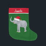 Grande Chaussette De Noël Eléphant mignon personnalisé<br><div class="desc">Ce bel éléphant de Noël est muni d'un mignon éléphant souriant portant un chapeau de Père Noël rouge avec un tronc surélevé. Ce joli stock de Noël animal personnalisé est décoré d'un charmant arrière - plan de vacances vert. Personnalisez avec votre propre texte en bas pour un cadeau élégant.</div>
