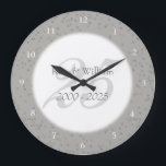 Grande Horloge Ronde 25e anniversaire Mariage de la fécule d'argent Con<br><div class="desc">25e WEDDING ANNIVERSARY SILVER STARDUST CONFETI CLOCK. Personalised with your names in faux silver over a beautiful script "25" (or a monogram initial),  on a delicate silver stardust confeti background. Designed by Pure Piglet © at www.zazzle.com/purepiglet*</div>