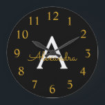 Grande Horloge Ronde Black Gold Modern Script Girl Monogramme Nom<br><div class="desc">Black and Gold Simple Script Monogram Clock. This makes the perfect sweet 16 birthday,  wedding,  bridal shower,  anniversary,  baby shower or bachelorette party gift for someone that loves glam luxury and chic styles.</div>