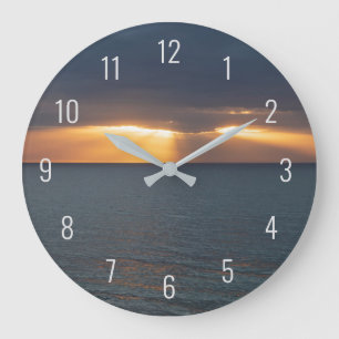 Grande Horloge Ronde Coucher de soleil sur l'océan en traversant les n