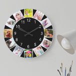 Grande Horloge Ronde Coutume 12 Collage photo noir gris rond<br><div class="desc">Horloge photo personnalisée avec vos propres photos personnalisées. Le modèle photo est configuré pour que vous puissiez ajouter 12 de vos photos préférées qui fonctionnent dans le sens des aiguilles d'une montre depuis le haut. Simple et fraîche, cette décoration noire aux numéros blancs séduira par sa décoration moderne et contemporaine....</div>