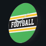 Grande Horloge Ronde FOOTBALL Green White Black Orange Racing Stripes<br><div class="desc">This sporty design features bold athletic FOOTBALL text inside wide black,  yellow orange,  and white racing stripes against bright green background.  The colors and text in this design can be personalized.</div>